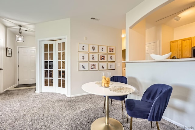 5255 Memphis St Unit 311, Denver, CO 80239 - living area with carpet, baseboards, and french doors