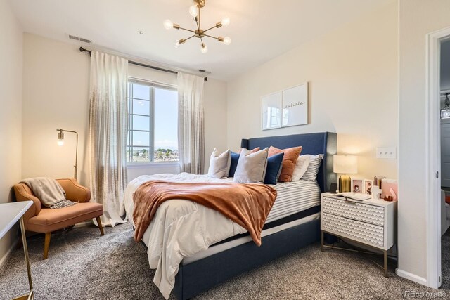 5255 Memphis St Unit 311, Denver, CO 80239 - carpeted bedroom featuring a chandelier