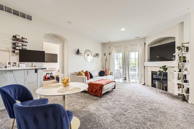 5255 Memphis St Unit 311, Denver, CO 80239 - living area featuring carpet and a tile fireplace