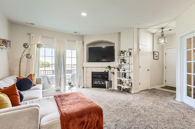 5255 Memphis St Unit 311, Denver, CO 80239 - carpeted living room with a tile fireplace, recessed lighting, and baseboards
