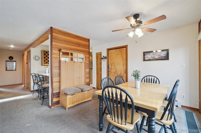 dining room with ceiling fan and carpet floors