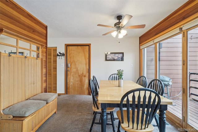 dining area featuring a ceiling fan and carpet floors