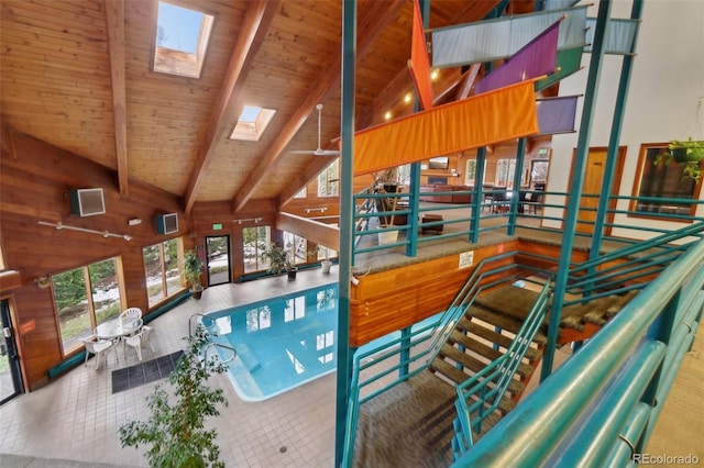 view of pool featuring a skylight