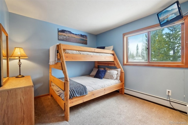 carpeted bedroom featuring a baseboard radiator and baseboards