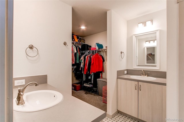1075 Spartan Ave, Berthoud, CO 80513 - full bathroom with a walk in closet and vanity