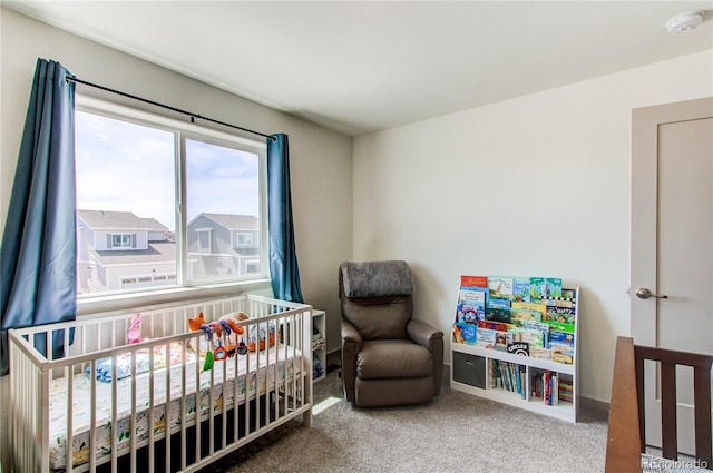 1075 Spartan Ave, Berthoud, CO 80513 - bedroom with carpet floors, baseboards, and a crib