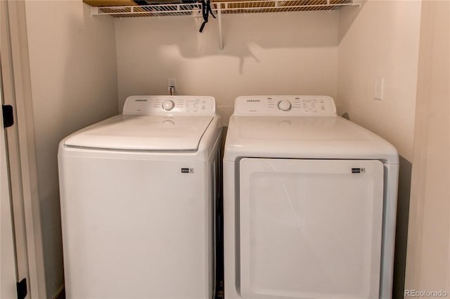 1075 Spartan Ave, Berthoud, CO 80513 - clothes washing area with separate washer and dryer and laundry area