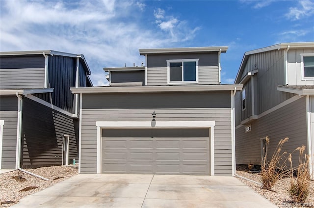 1075 Spartan Ave, Berthoud, CO 80513 - view of front of house featuring a garage and driveway