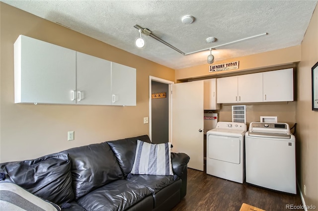 1350 Tolland Rd, Rollinsville, CO 80474 - living room featuring washing machine and dryer, dark wood-style flooring, and a textured ceiling