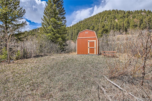 1350 Tolland Rd, Rollinsville, CO 80474 - view of shed with a wooded view