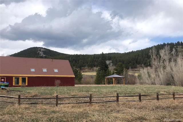 1350 Tolland Rd, Rollinsville, CO 80474 - view of yard featuring fence, a rural view, a gazebo, a mountain view, and a forest view