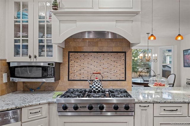 kitchen featuring backsplash, white cabinetry, and stainless steel appliances