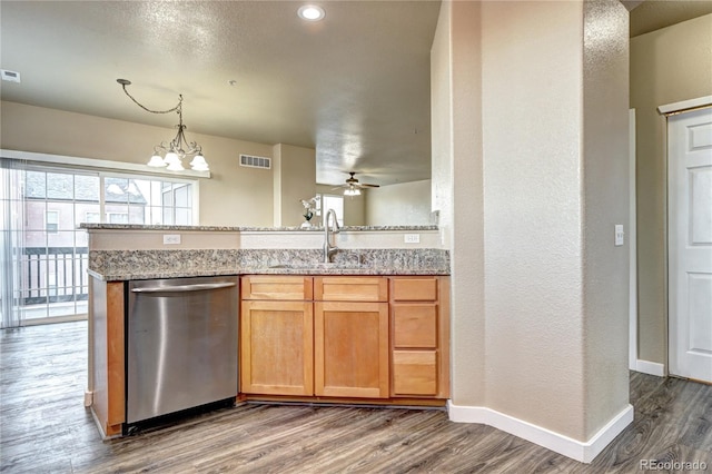 kitchen featuring sink, wood-type flooring, light stone countertops, and dishwasher