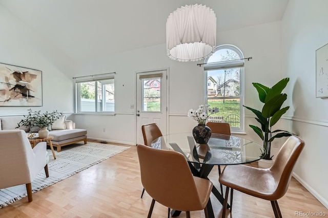 494 Owl Dr Unit 4, Louisville, CO 80027 - dining room with light wood-type flooring, baseboards, and lofted ceiling