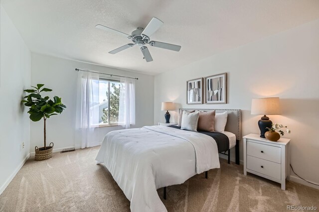 494 Owl Dr Unit 4, Louisville, CO 80027 - bedroom featuring light colored carpet, baseboards, and ceiling fan