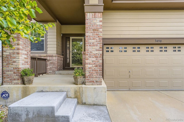 3490 Craftsbury Dr, Highlands Ranch, CO 80126 - doorway to property featuring a garage and driveway