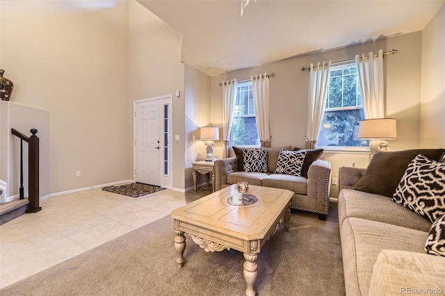 3490 Craftsbury Dr, Highlands Ranch, CO 80126 - tiled living area with stairs and a high ceiling