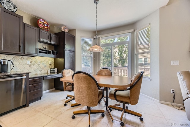 3490 Craftsbury Dr, Highlands Ranch, CO 80126 - dining space with light tile patterned floors and built in desk