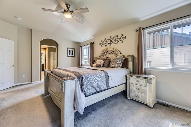 3490 Craftsbury Dr, Highlands Ranch, CO 80126 - carpeted bedroom with arched walkways, ceiling fan, lofted ceiling, and connected bathroom