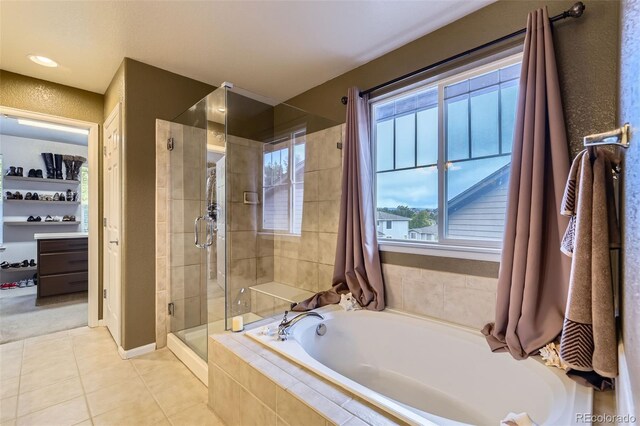 3490 Craftsbury Dr, Highlands Ranch, CO 80126 - bathroom featuring a shower stall, a garden tub, and tile patterned flooring