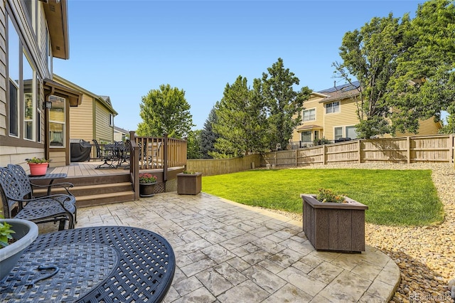 3490 Craftsbury Dr, Highlands Ranch, CO 80126 - fenced backyard featuring a patio and a deck
