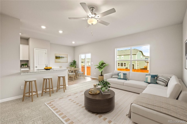 living room featuring light colored carpet and ceiling fan