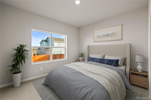 bedroom with light colored carpet