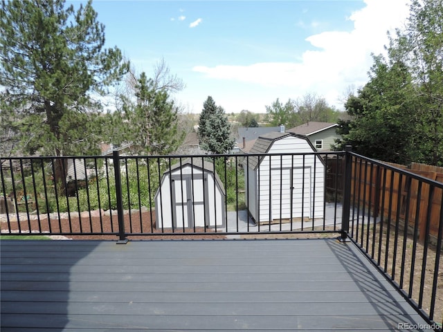 7753 W Plymouth Pl S, Littleton, CO 80128 - wooden terrace with a storage shed and an outbuilding