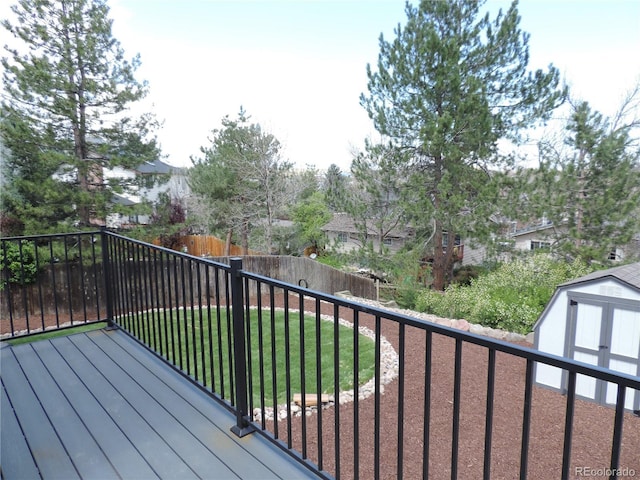 7753 W Plymouth Pl S, Littleton, CO 80128 - wooden terrace featuring a shed and an outdoor structure