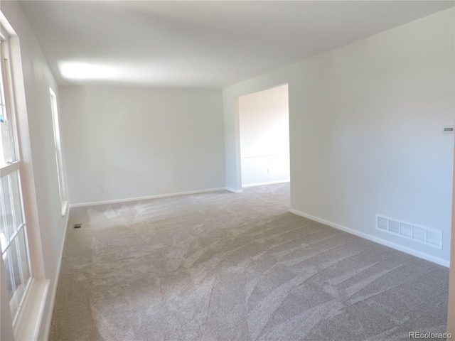 7753 W Plymouth Pl S, Littleton, CO 80128 - carpeted spare room featuring baseboards