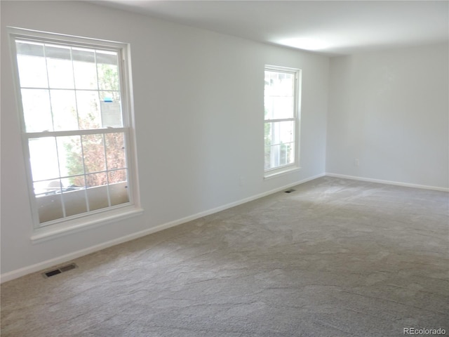 7753 W Plymouth Pl S, Littleton, CO 80128 - carpeted spare room featuring healthy amount of natural light and baseboards