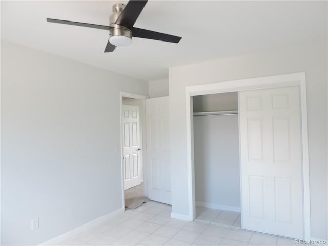 7753 W Plymouth Pl S, Littleton, CO 80128 - unfurnished bedroom with light tile patterned floors, a closet, baseboards, and ceiling fan