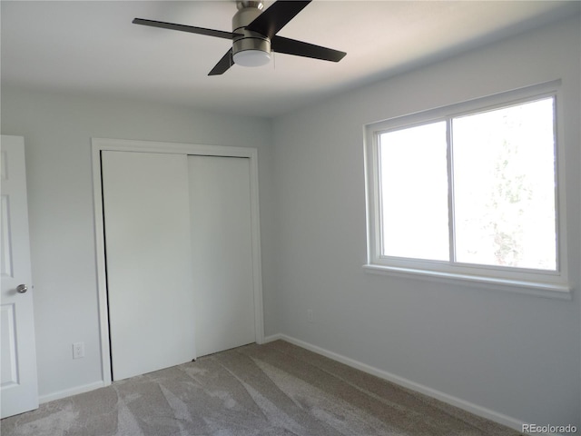 7753 W Plymouth Pl S, Littleton, CO 80128 - unfurnished bedroom featuring carpet floors, a closet, a ceiling fan, and baseboards
