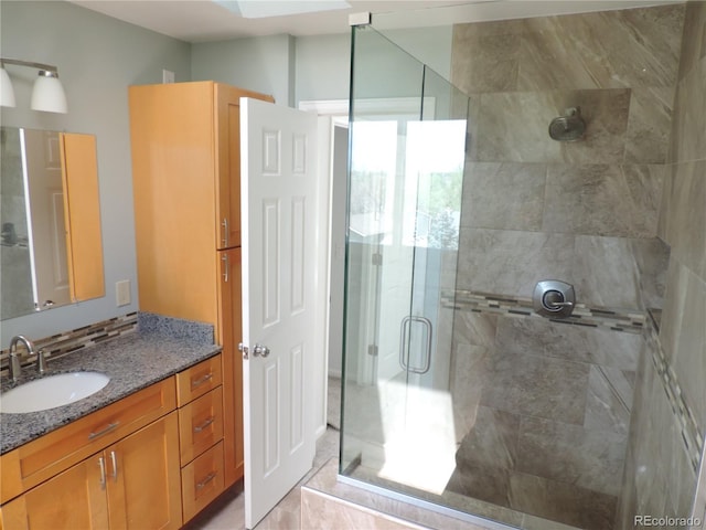 7753 W Plymouth Pl S, Littleton, CO 80128 - bathroom with a stall shower, vanity, and tile patterned floors