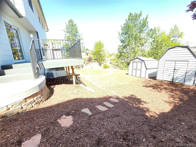 7753 W Plymouth Pl S, Littleton, CO 80128 - view of yard with a storage shed and a wooden deck