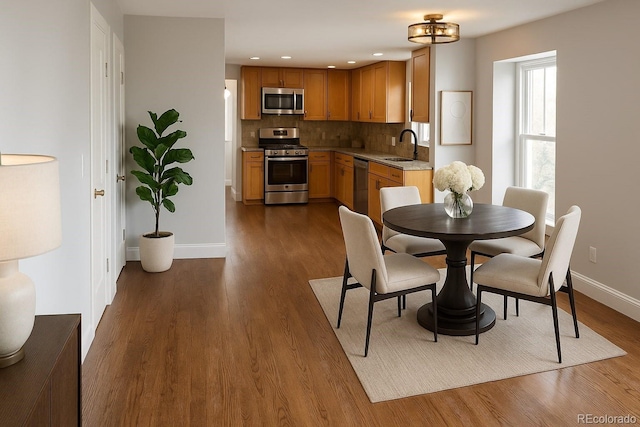 7753 W Plymouth Pl S, Littleton, CO 80128 - dining room featuring dark wood finished floors and recessed lighting