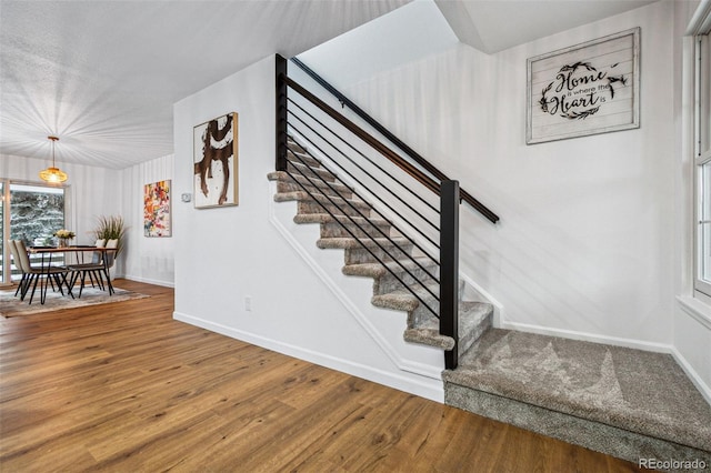 stairway featuring hardwood / wood-style floors