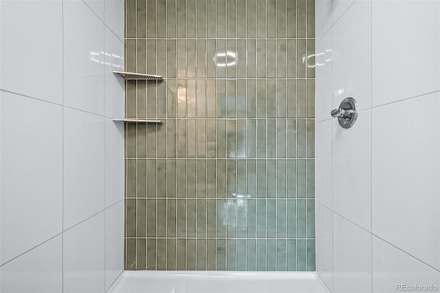 bathroom with a tile shower