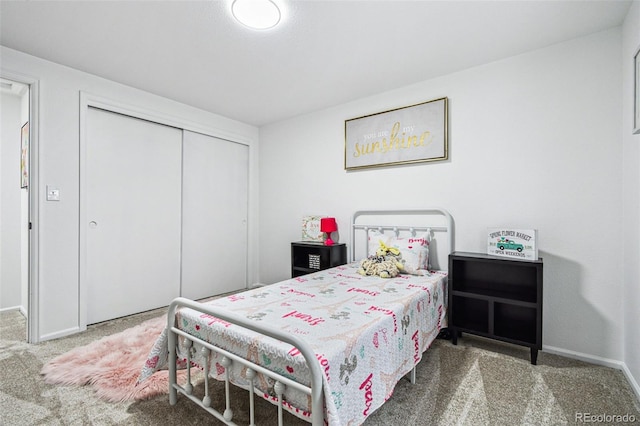 carpeted bedroom with a closet