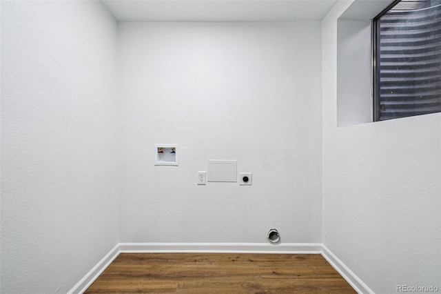 clothes washing area featuring hardwood / wood-style flooring, electric dryer hookup, and washer hookup