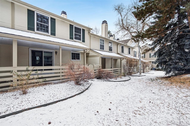 view of snow covered property