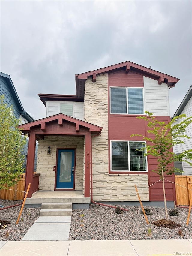 21104 E 63rd Dr, Aurora, CO 80019 - view of front of property with stone siding and a porch