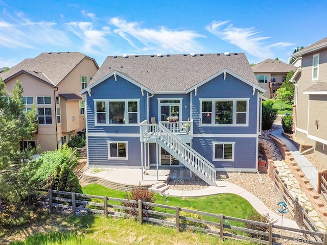 5309 W Hoover Dr, Littleton, CO 80123 - rear view of property featuring stairs, a fenced backyard, a patio area, a deck, and roof with shingles