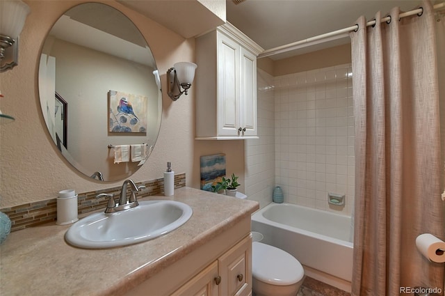 bathroom with a textured wall, vanity, toilet, and shower / tub combo with curtain