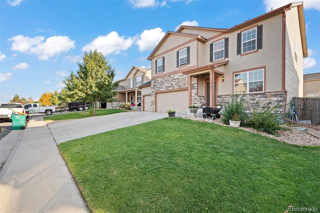 view of front of property featuring a front yard and a garage