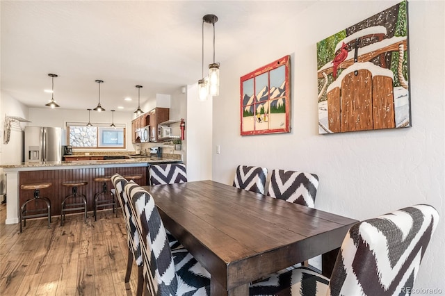 dining area featuring hardwood / wood-style floors