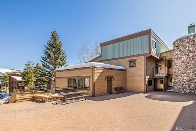 exterior space with a patio area and decorative driveway