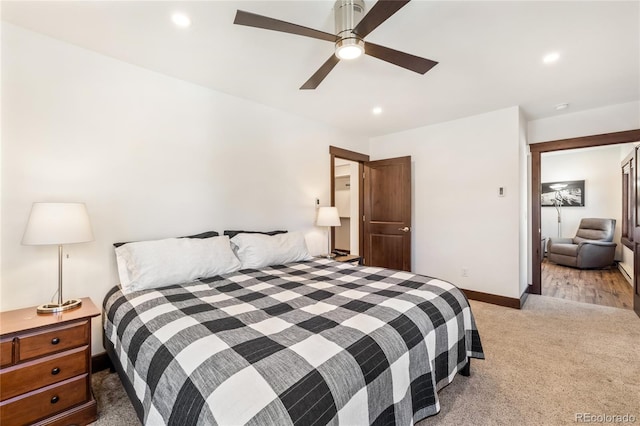 bedroom featuring recessed lighting, light colored carpet, baseboards, and a ceiling fan