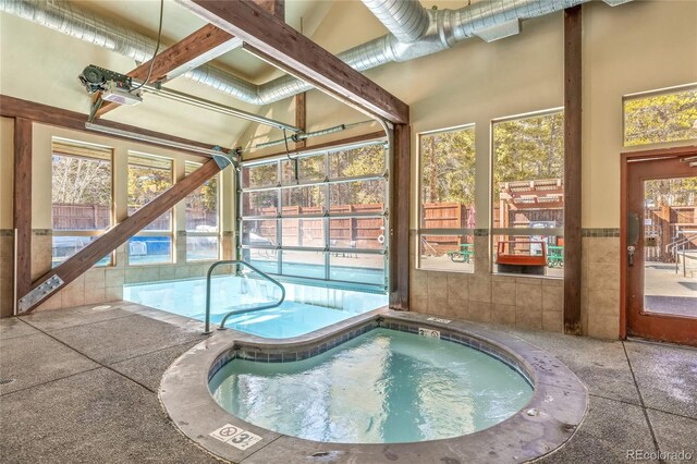 view of pool featuring a swimming pool and an indoor in ground hot tub