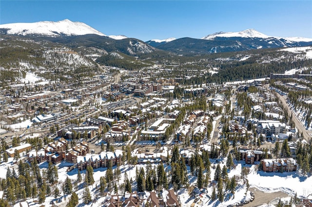 snowy aerial view featuring a mountain view